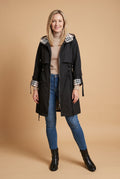 Women’s Hooded Trench Coat with Drawstring in Black — studio front