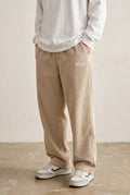Corduroy Trousers with Drawstring in Beige — studio front
