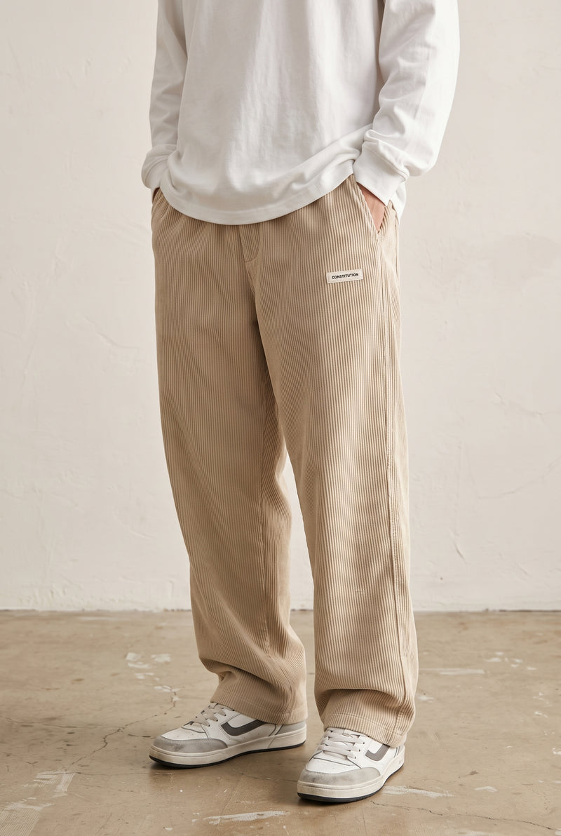 Corduroy Trousers with Drawstring in Beige — studio front