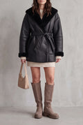 Faux Leather Belted Coat in Black — studio front