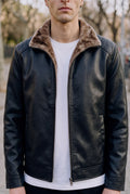 Faux Leather Bomber Jacket in Black — studio front
