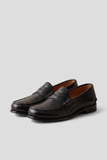Faux Leather Penny Loafers in Black — studio front