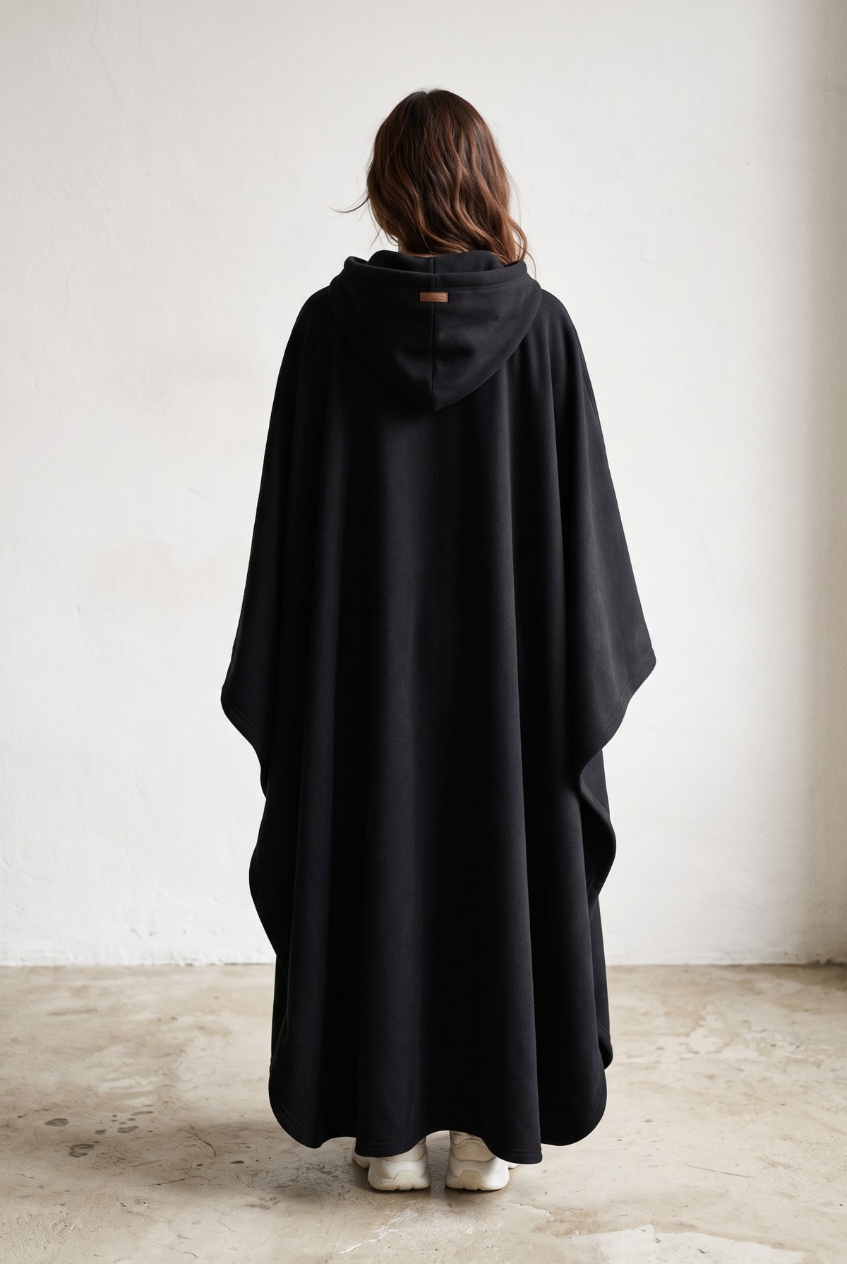 Hooded Cape with Wide Openings in Black — studio angle