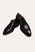 Leather Brogue Dress Shoes in Black — front view