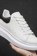 Leather Low-Top Sneakers in Black — front view