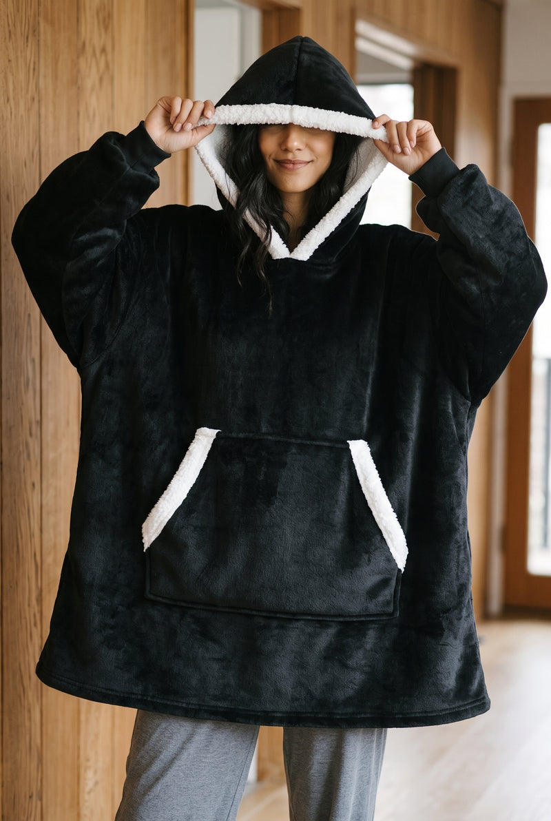 Oversized Fleece Blanket Hoodie in Black — studio front