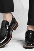 Polished Leather Penny Loafers in Black — front view