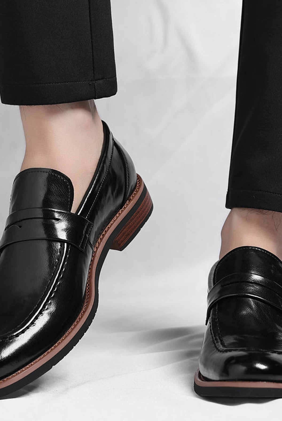 Polished Leather Penny Loafers in Black — front view