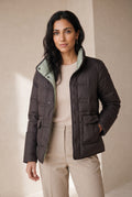 Reversible Quilted Down Jacket in Black — studio front