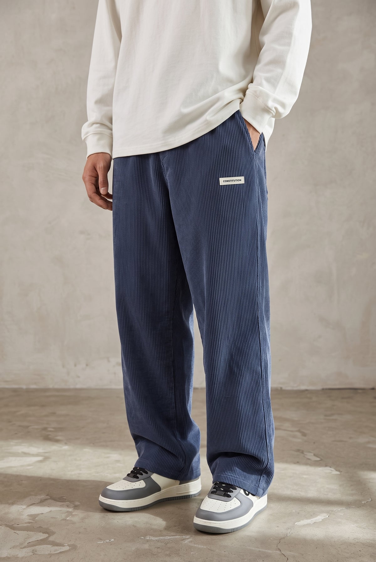 Corduroy Trousers with Drawstring in Blue — studio front