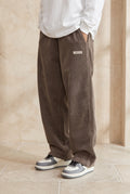 Corduroy Trousers with Drawstring in Brown — studio front