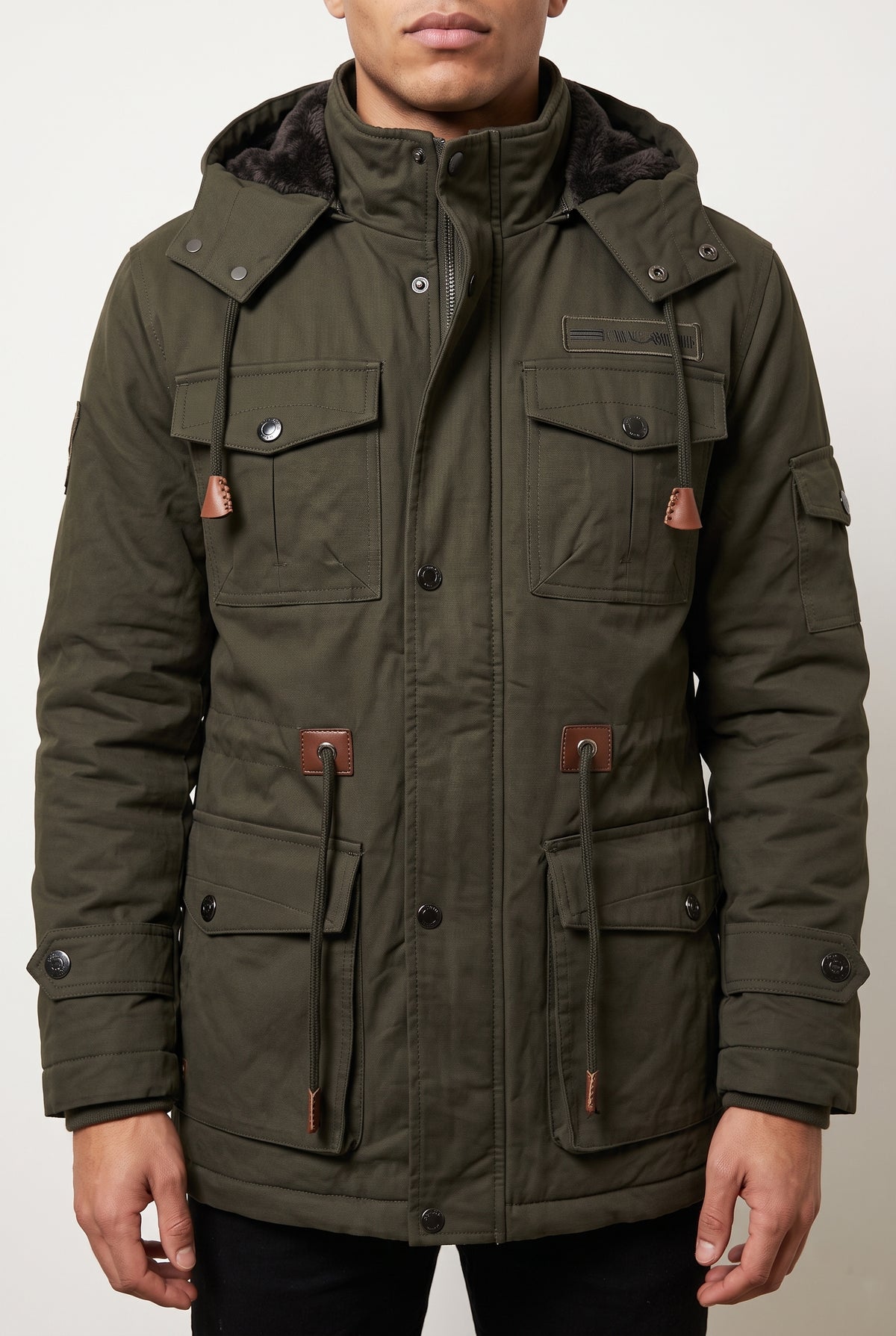 Faux-Fur Lined Parka in Dark Green — studio front