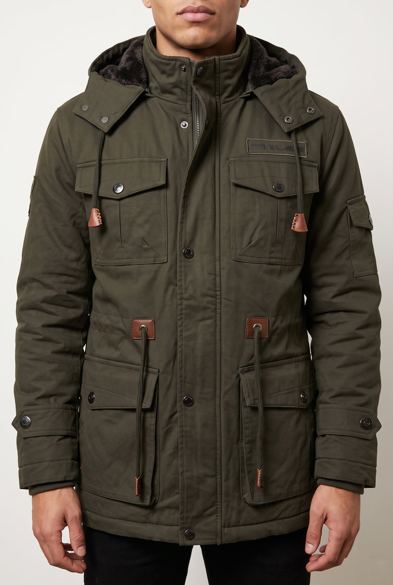 Faux-Fur Lined Parka in Dark Green — studio front