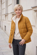 Women's Reversible Quilted Jacket with Stand Collar in Fire Orange — lifestyle