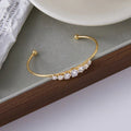 Gold Gold Open Bangle Bracelet with Graduated Diamond-style Stones - Bangles - Photo 7