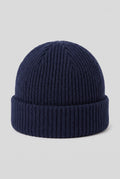 Ribbed Knit Dome Beanie in Navy Blue — studio front