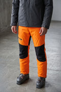 Detachable Bib Ski Trousers in Orange — studio front