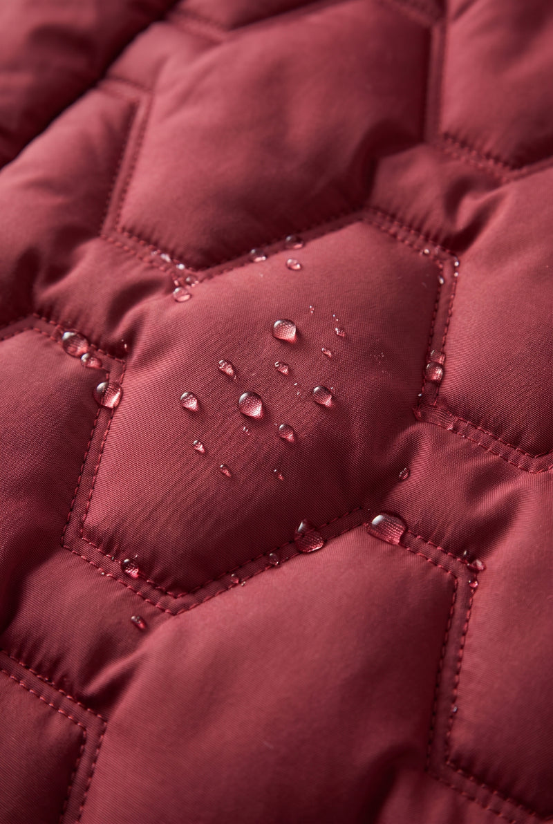 Longline Hooded Puffer Coat in Red — studio detail