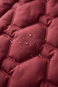 Longline Hooded Puffer Coat in Red — studio detail