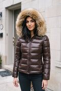 Glossy Puffer Jacket with Faux Fur Hood in Brown — lifestyle