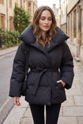 Belted Puffer Coat in Black — studio front