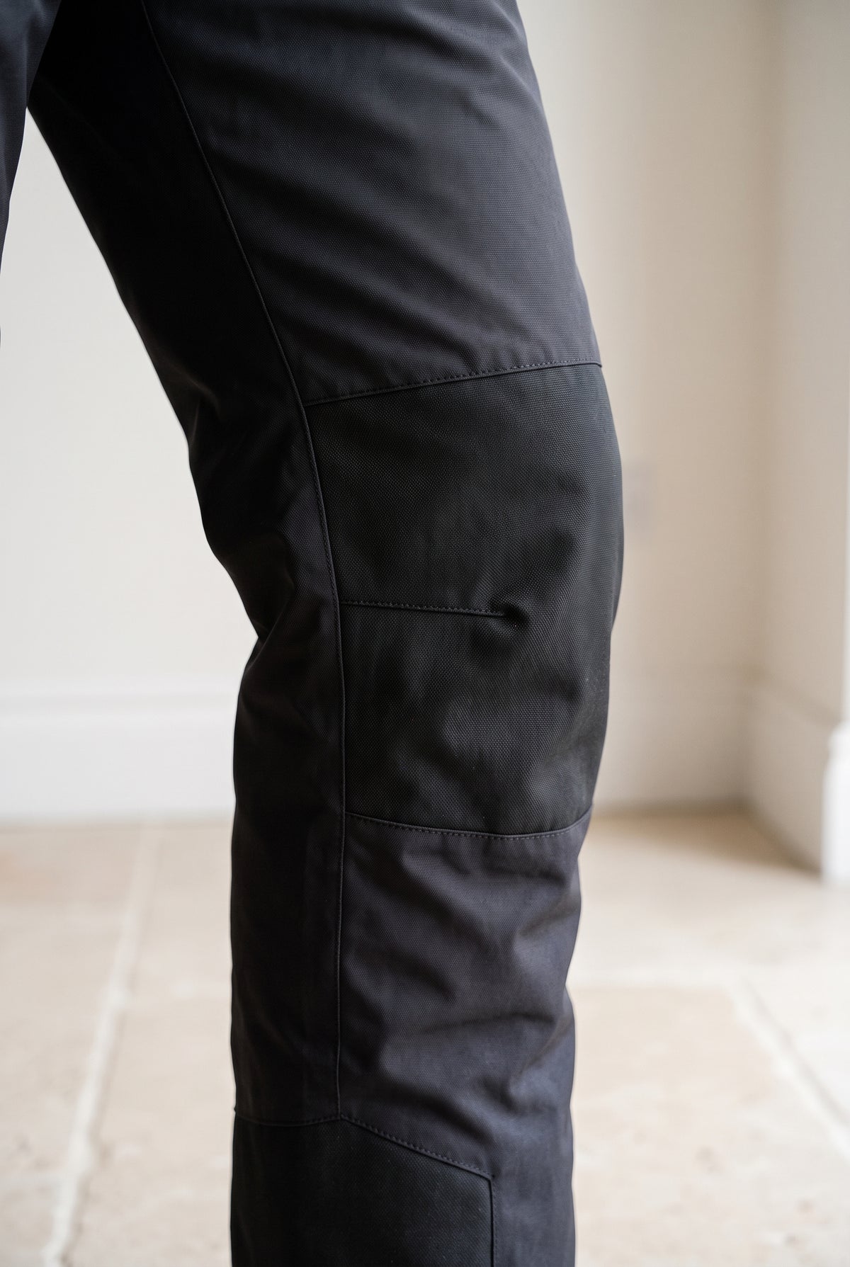 Detachable Bib Ski Trousers in Black — studio detail