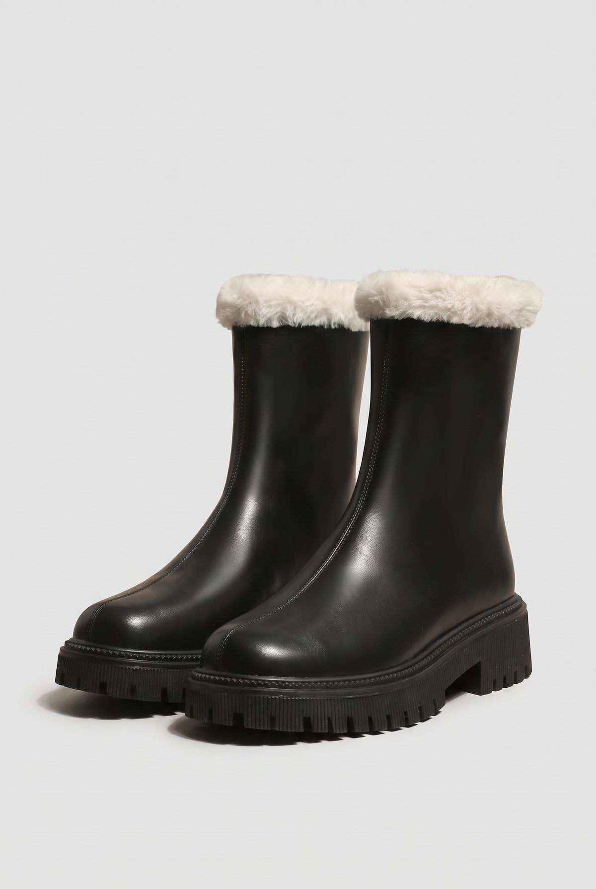 Faux-Fur Lined Ankle Boots in Black — studio front