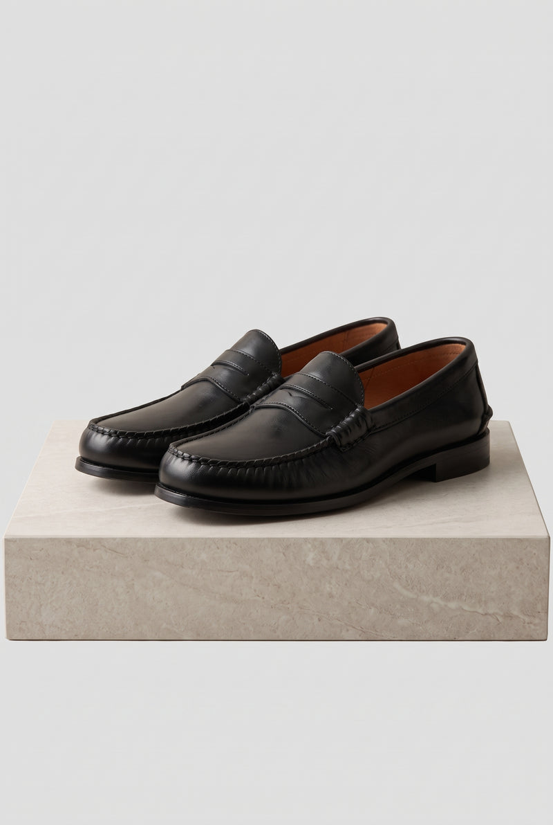 Faux Leather Penny Loafers in Black — studio angle