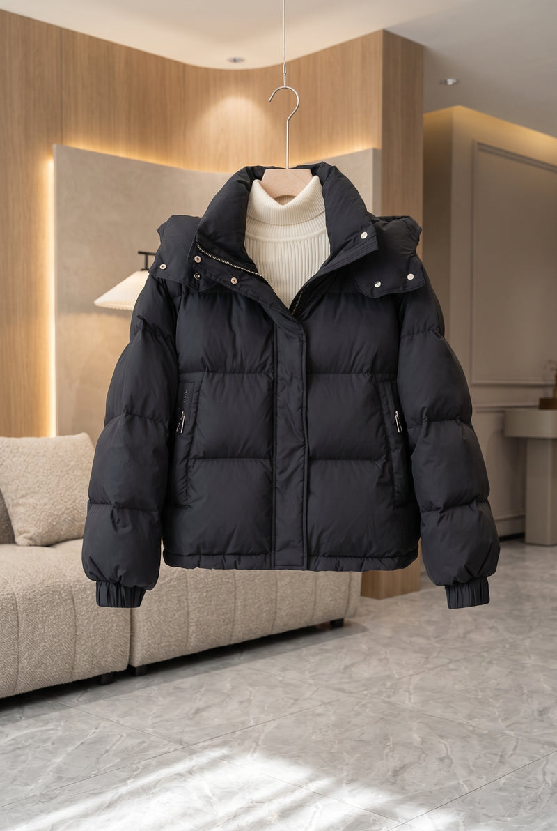 High Neck Hooded Puffer Jacket in Black — studio front
