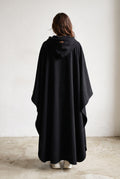 Hooded Cape with Wide Openings in Black — studio angle