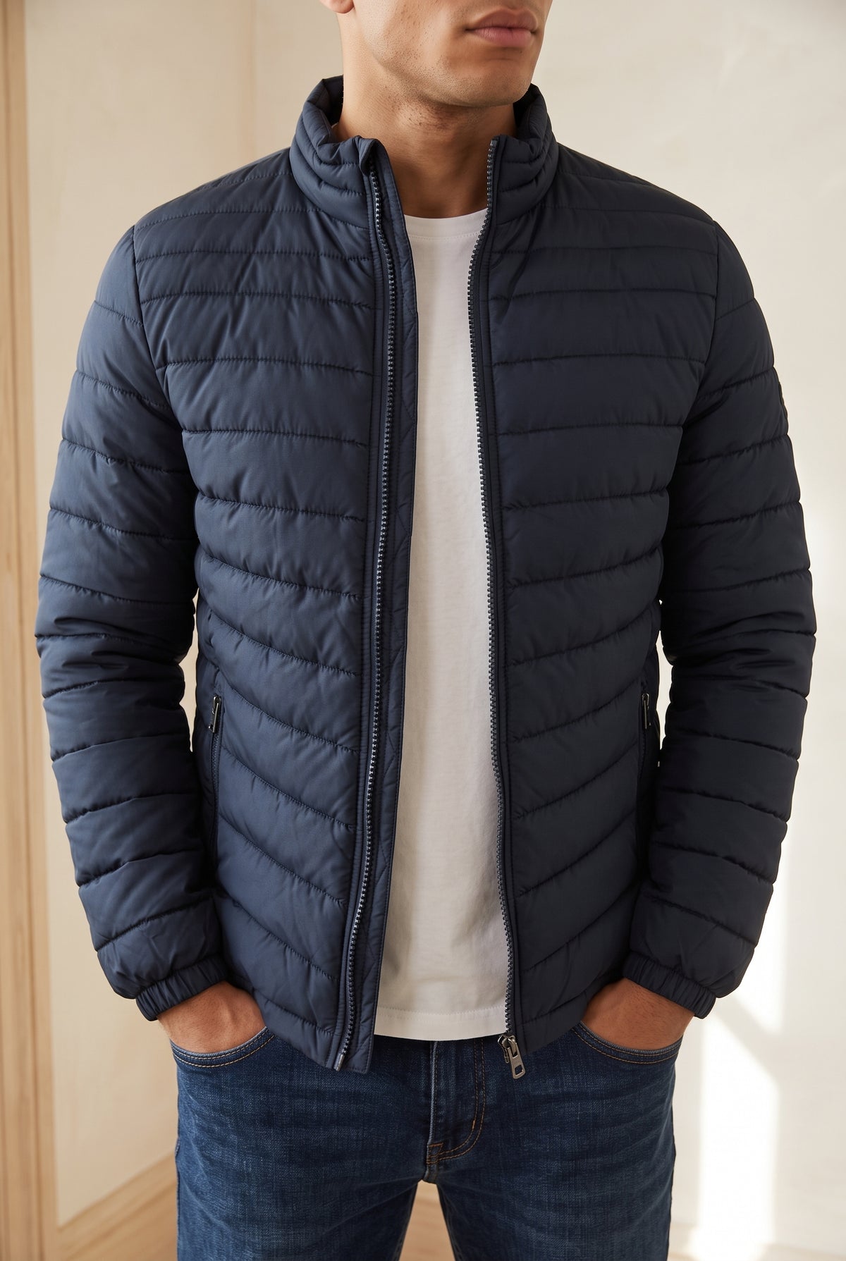 Quilted Puffer Jacket in Navy Blue — studio front