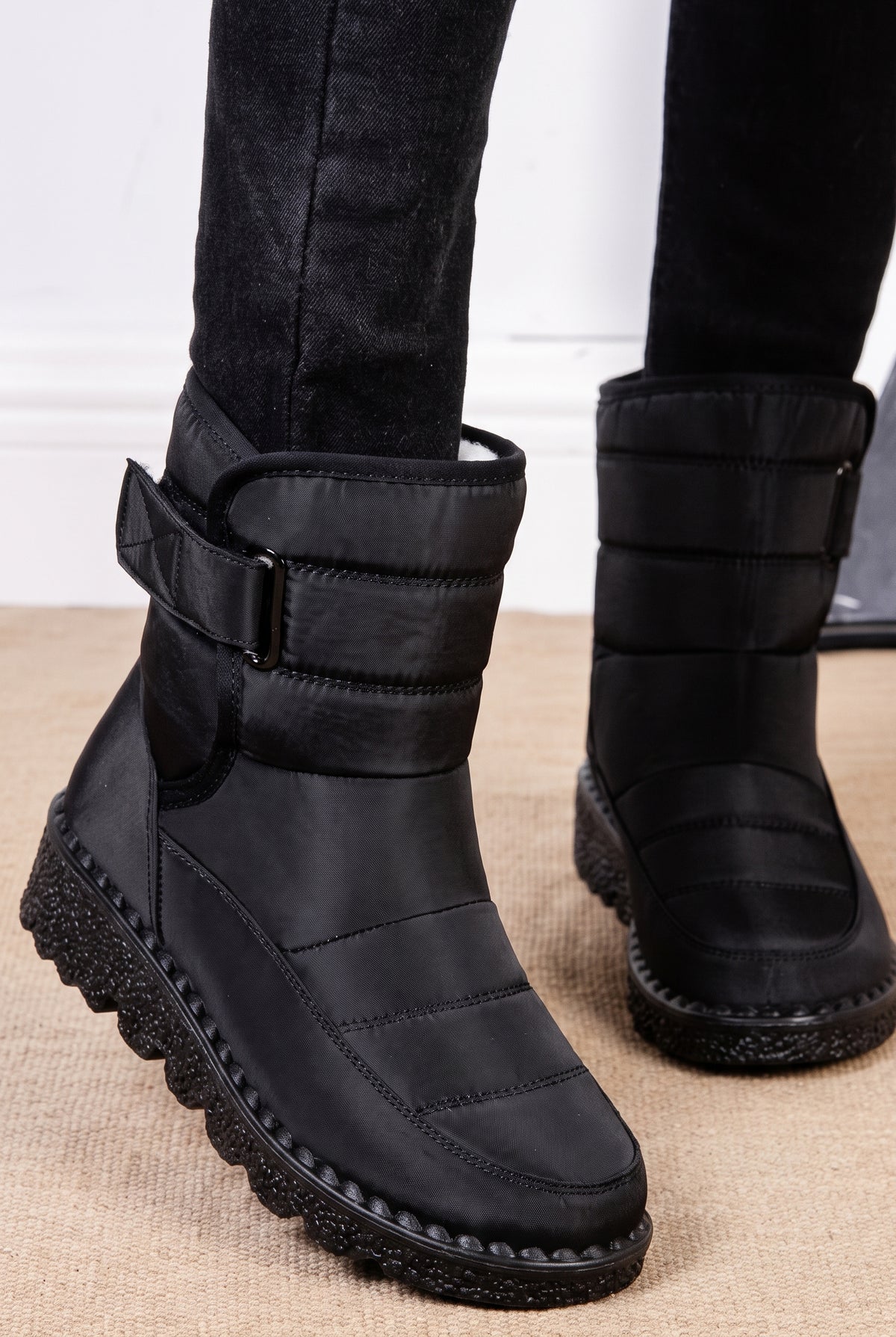 Quilted Ankle Snow Boots in Black — studio angle