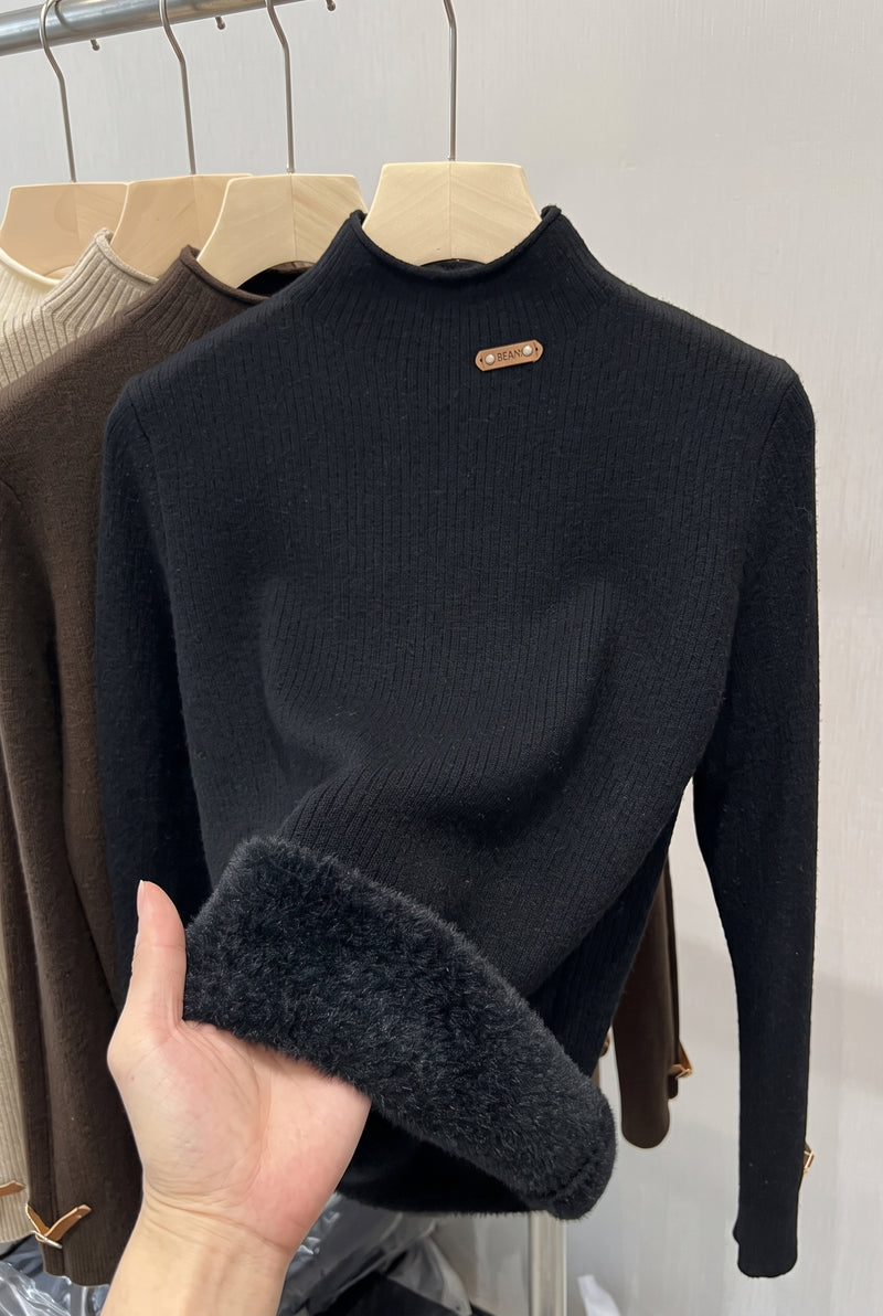 Ribbed High-Neck Sweater in Black — studio front