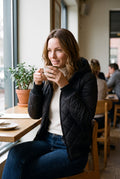 Women's Quilted Puffer Jacket Regular Fit in Black — cafe table