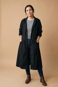 Women's Raincoat Long Elegant in Black — studio front