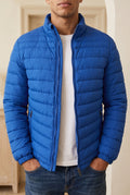 Quilted Puffer Jacket in Blue — studio front