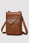 Pebbled Faux Leather Crossbody Bag in Brown — studio front