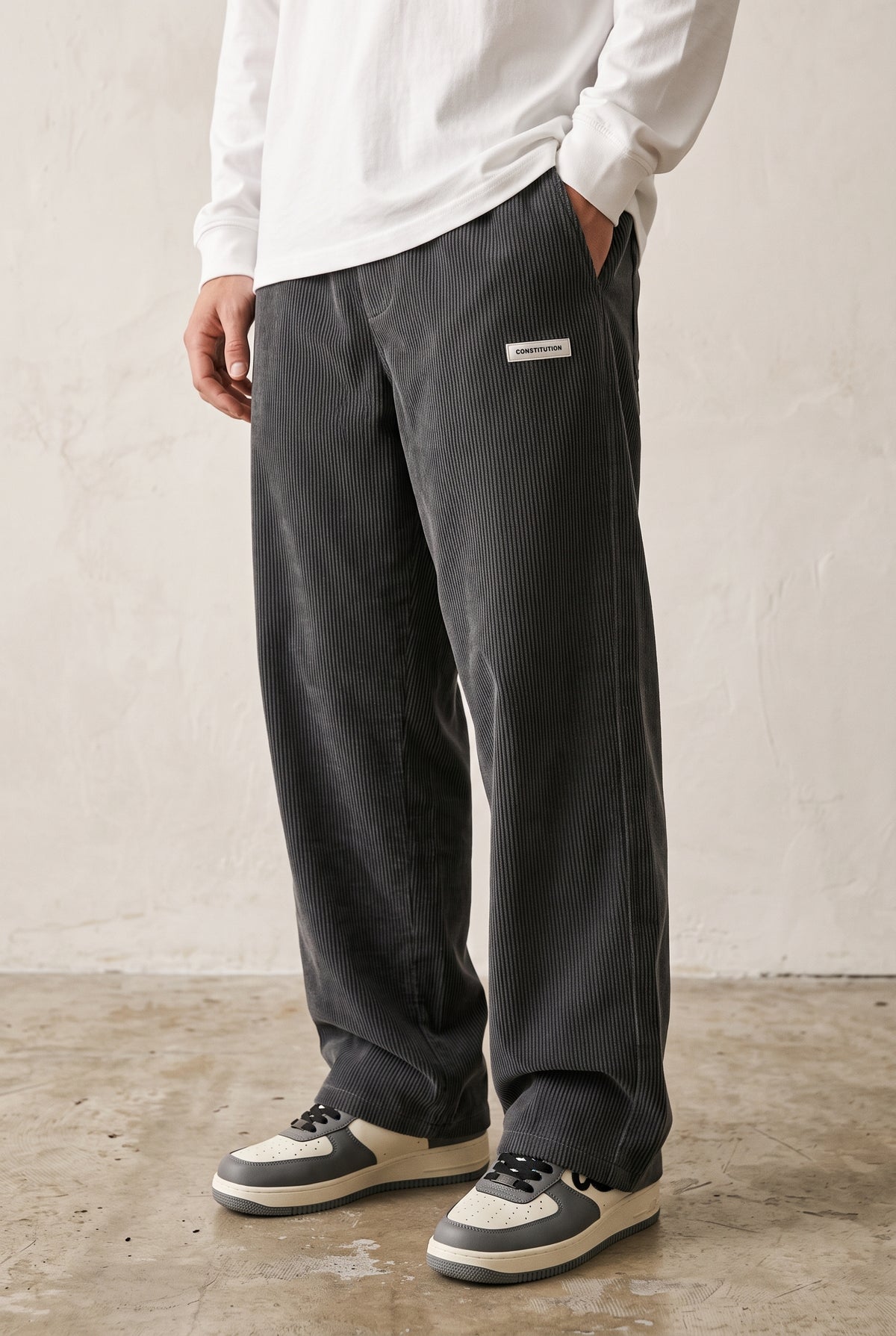 Corduroy Trousers with Drawstring in Dark Grey — studio front