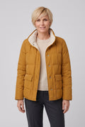 Women's Reversible Quilted Jacket with Stand Collar in Fire Orange — studio front