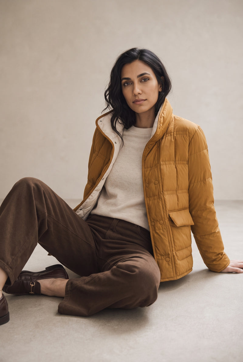 Reversible Quilted Down Jacket in Orange — studio front
