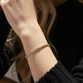 Gold Baguette and Round Stone Gold-tone Tennis Bracelet - Photo 3