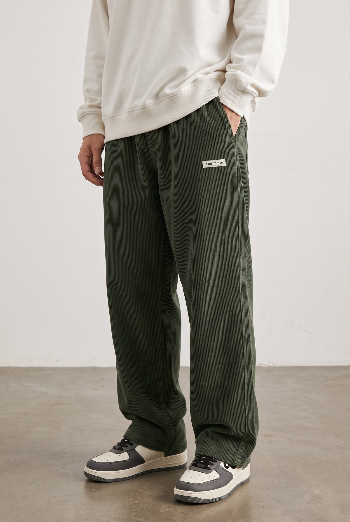 Corduroy Trousers with Drawstring in Green — studio front