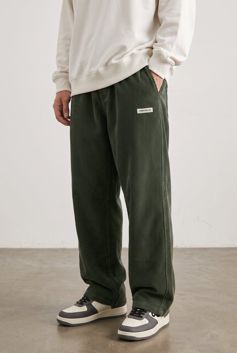 Corduroy Trousers with Drawstring in Green — studio front