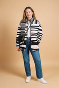Women's Puffer Jacket Abstract Pattern in Multicolor — studio full body