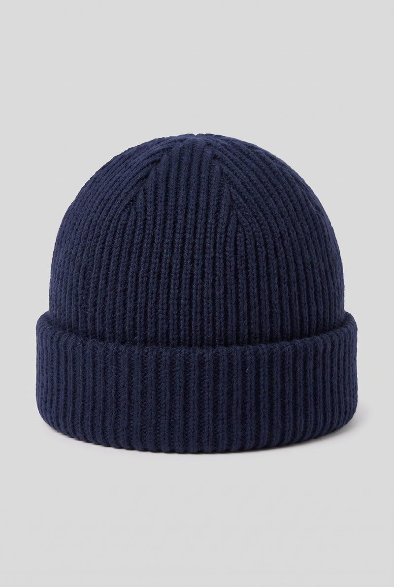 Ribbed Knit Dome Beanie in Navy Blue — studio front