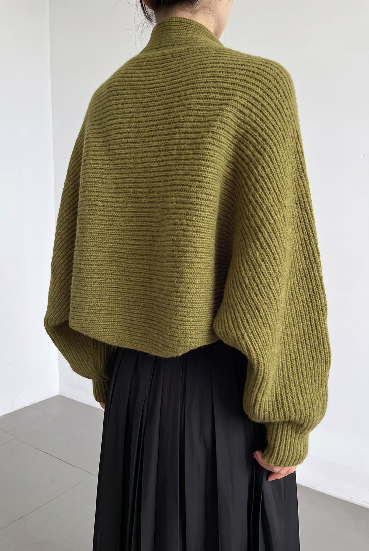 Ribbed Knit Shrug in Olive — studio angle