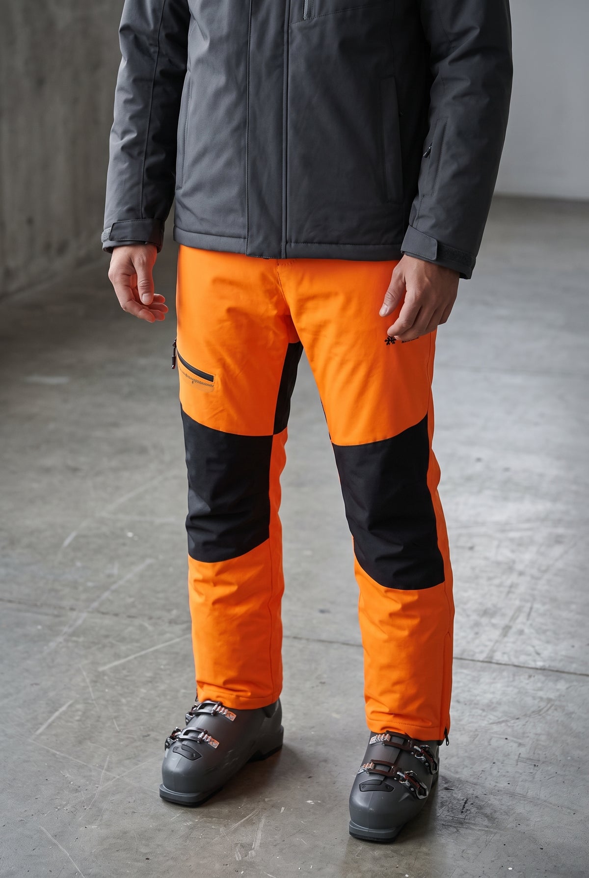 Detachable Bib Ski Trousers in Orange — studio front