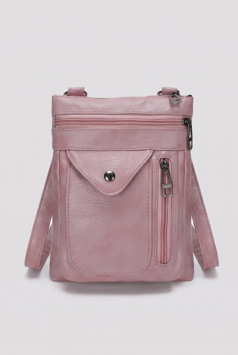Pebbled Faux Leather Crossbody Bag in Pink — studio front