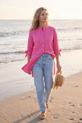 Women's Oversized Button-Up Shirt in Pink — lifestyle seaside evening