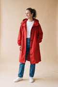 Women's Windbreaker Oversized Hooded in Red — studio shot
